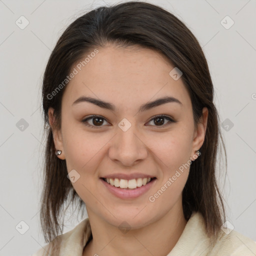 Joyful latino young-adult female with medium  brown hair and brown eyes