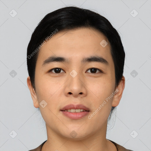 Joyful asian young-adult male with short  black hair and brown eyes