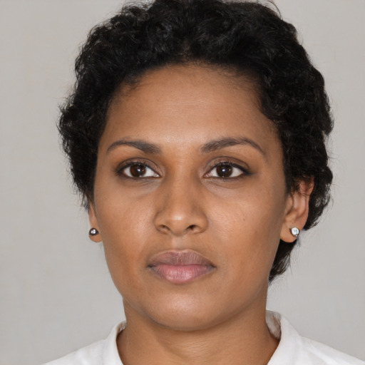Neutral black young-adult female with short  black hair and brown eyes