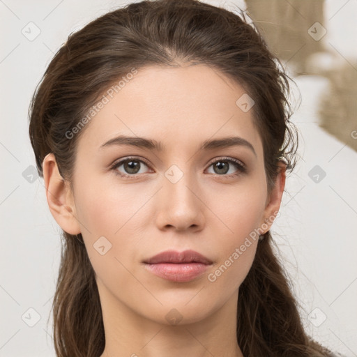 Neutral white young-adult female with long  brown hair and brown eyes