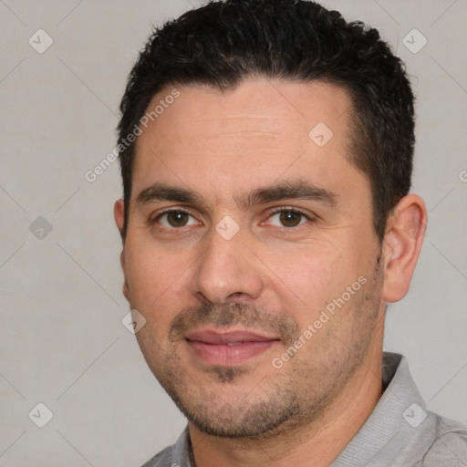 Joyful white young-adult male with short  black hair and brown eyes