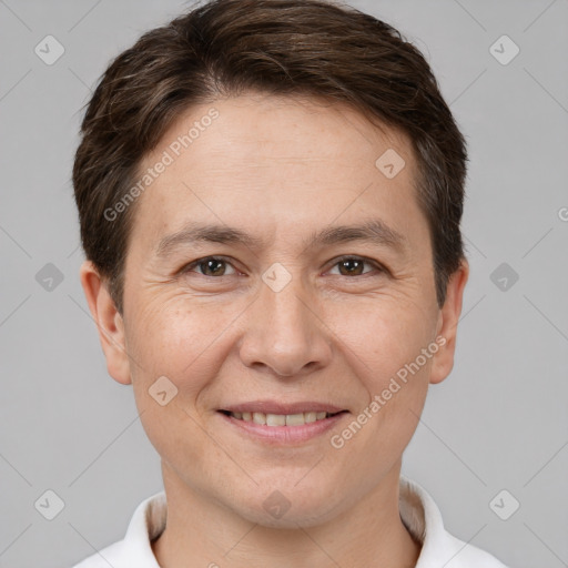 Joyful white adult male with short  brown hair and brown eyes