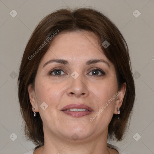 Joyful white adult female with medium  brown hair and brown eyes