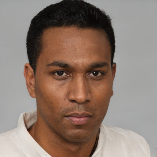 Neutral black young-adult male with short  brown hair and brown eyes