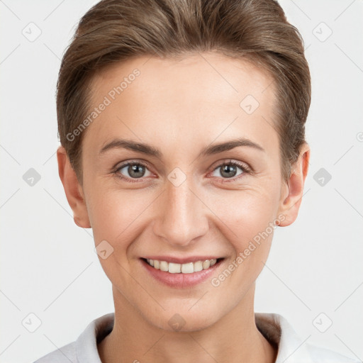 Joyful white young-adult female with short  brown hair and grey eyes