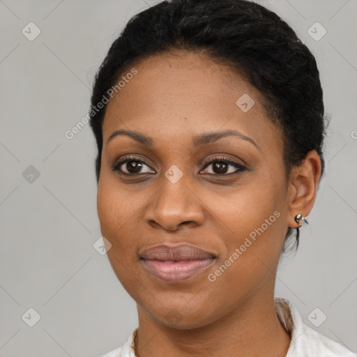 Joyful black young-adult female with short  brown hair and brown eyes