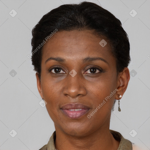 Joyful black adult female with short  brown hair and brown eyes