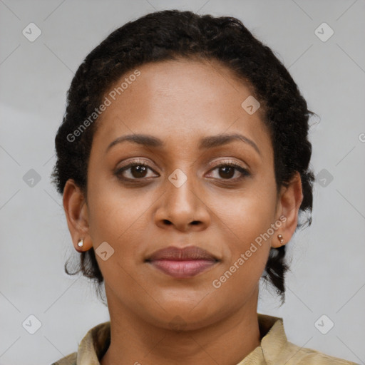 Joyful black young-adult female with short  brown hair and brown eyes