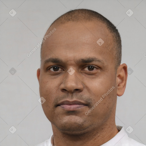Neutral latino young-adult male with short  brown hair and brown eyes