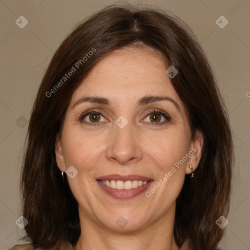 Joyful white adult female with medium  brown hair and brown eyes