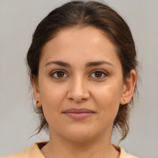 Joyful white young-adult female with medium  brown hair and brown eyes