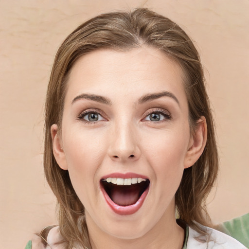 Joyful white young-adult female with medium  brown hair and green eyes