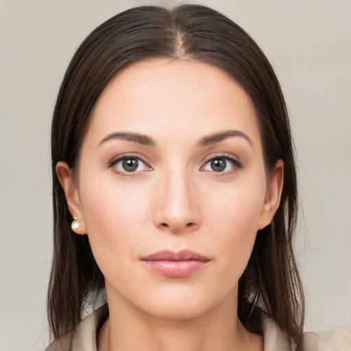 Neutral white young-adult female with long  brown hair and brown eyes