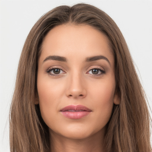 Neutral white young-adult female with long  brown hair and brown eyes