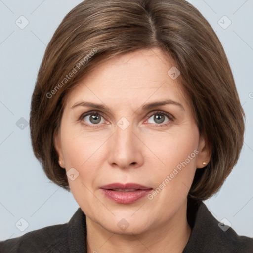 Joyful white adult female with medium  brown hair and grey eyes