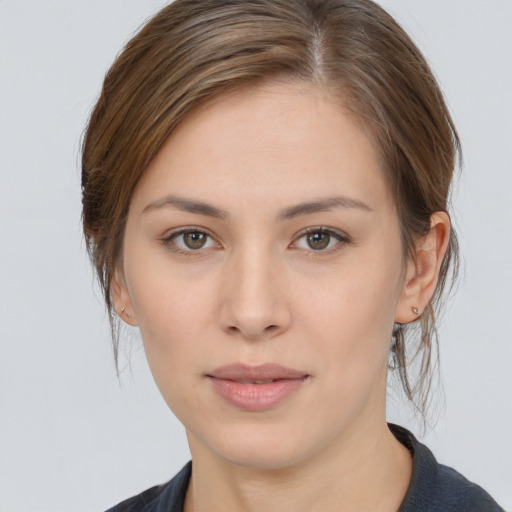 Neutral white young-adult female with medium  brown hair and brown eyes