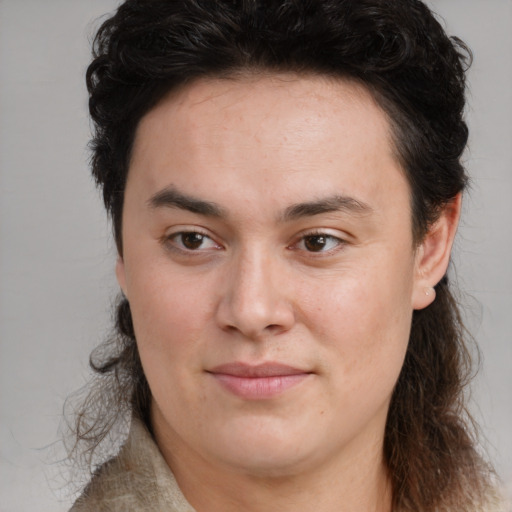 Joyful white young-adult female with medium  brown hair and brown eyes