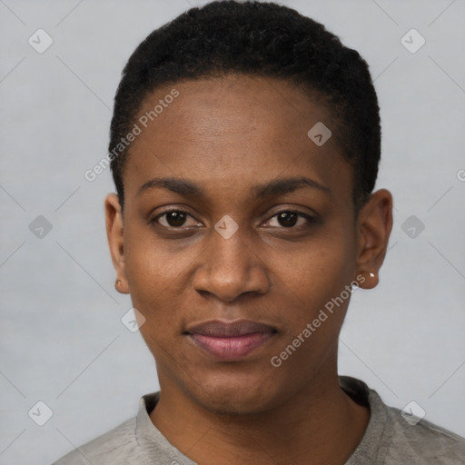 Joyful black young-adult female with short  black hair and brown eyes