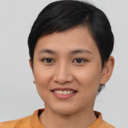 Joyful asian young-adult female with short  brown hair and brown eyes