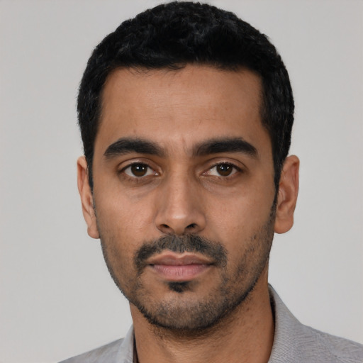 Neutral latino young-adult male with short  black hair and brown eyes