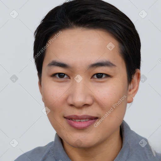 Joyful asian young-adult female with short  brown hair and brown eyes