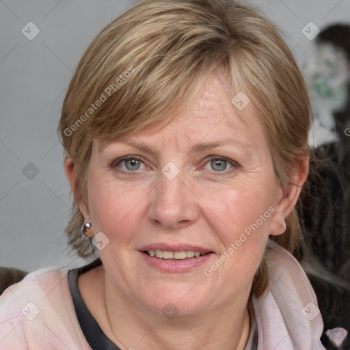 Joyful white adult female with medium  brown hair and blue eyes