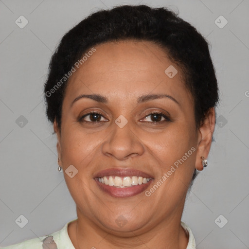 Joyful latino adult female with short  brown hair and brown eyes