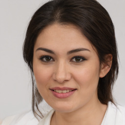 Joyful white young-adult female with medium  brown hair and brown eyes