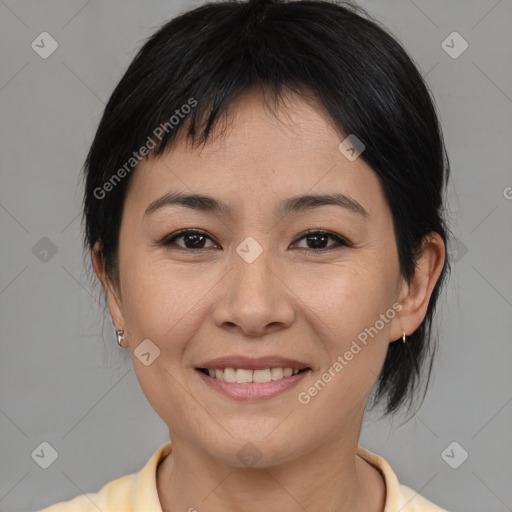 Joyful asian young-adult female with medium  brown hair and brown eyes