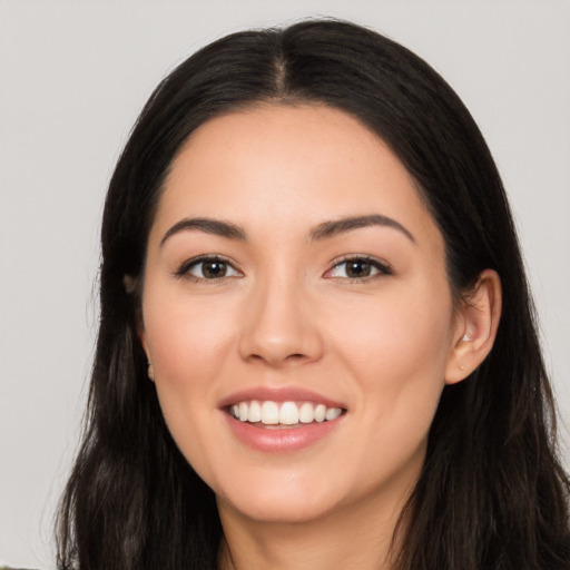 Joyful white young-adult female with long  black hair and brown eyes