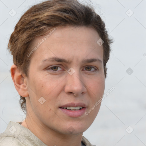 Joyful white adult female with short  brown hair and grey eyes