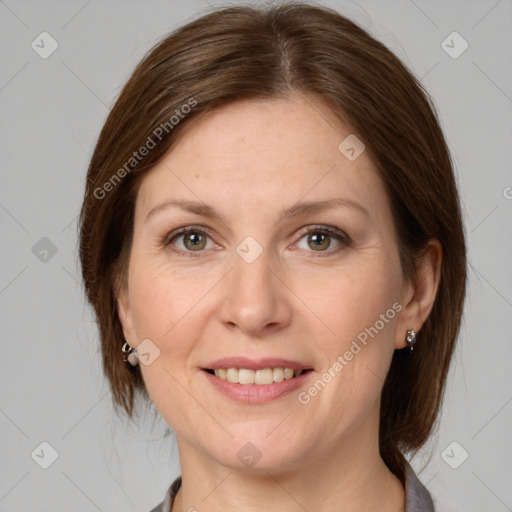 Joyful white adult female with medium  brown hair and grey eyes