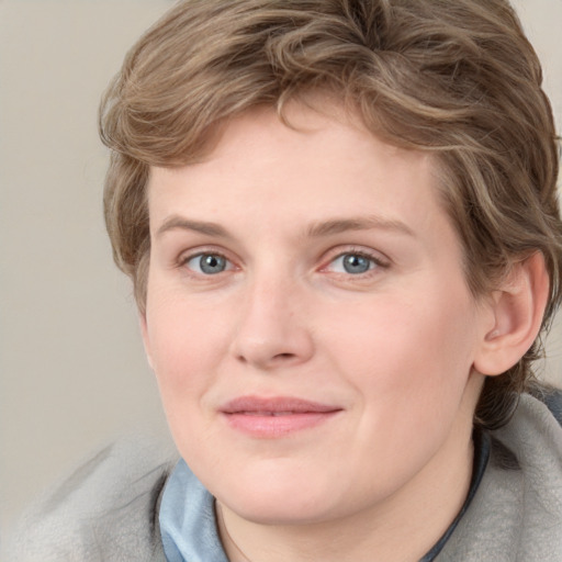 Joyful white young-adult female with medium  brown hair and blue eyes