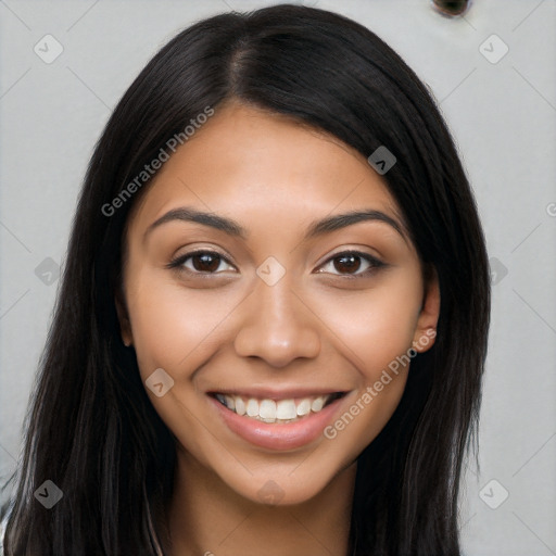 Joyful latino young-adult female with long  black hair and brown eyes