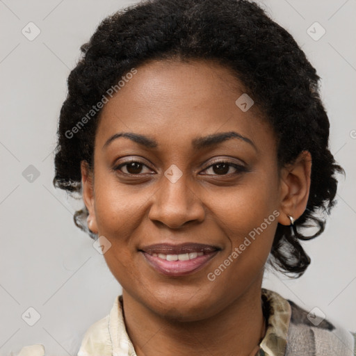 Joyful black young-adult female with medium  brown hair and brown eyes