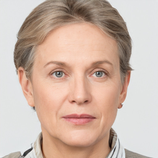 Joyful white adult female with short  brown hair and grey eyes