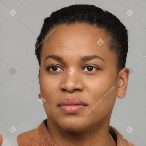 Joyful black young-adult female with short  black hair and brown eyes