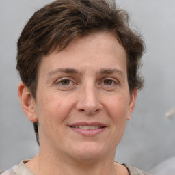 Joyful white adult female with short  brown hair and brown eyes