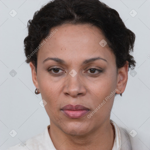 Joyful latino adult female with short  brown hair and brown eyes