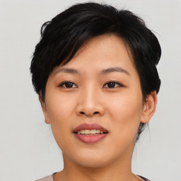 Joyful asian young-adult female with short  black hair and brown eyes