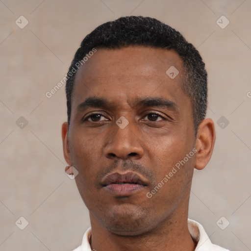 Neutral latino adult male with short  black hair and brown eyes