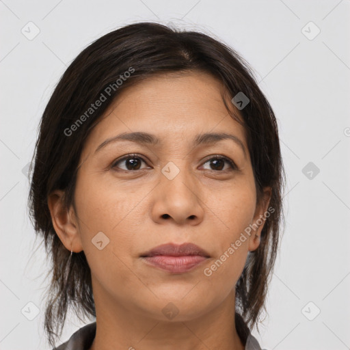 Joyful white adult female with medium  brown hair and brown eyes