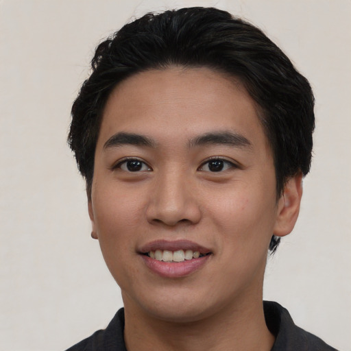 Joyful asian young-adult male with short  black hair and brown eyes