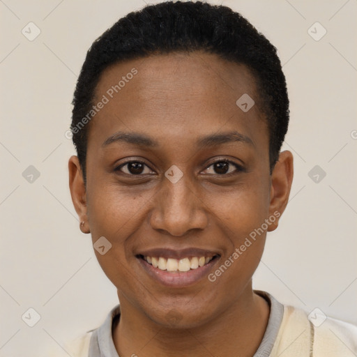 Joyful black young-adult female with short  black hair and brown eyes