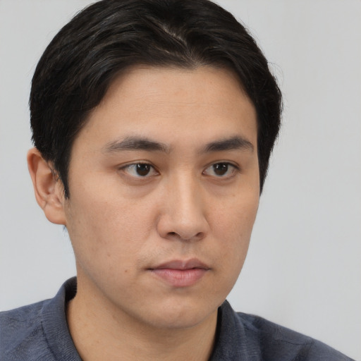 Neutral asian young-adult male with short  brown hair and brown eyes