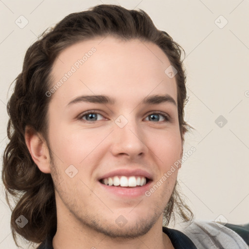 Joyful white young-adult male with medium  brown hair and brown eyes