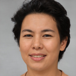 Joyful asian young-adult female with short  brown hair and brown eyes