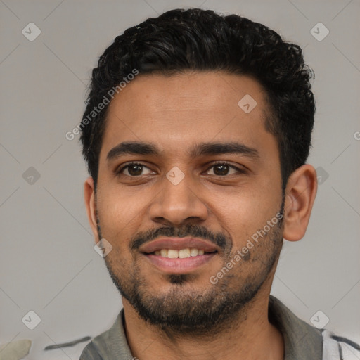 Joyful latino young-adult male with short  black hair and brown eyes