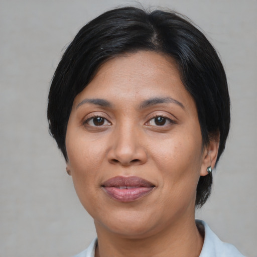 Joyful asian adult female with medium  black hair and brown eyes