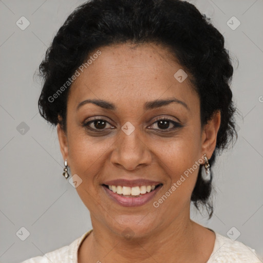 Joyful latino adult female with short  black hair and brown eyes